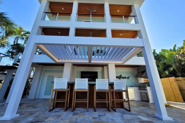 Outdoor Bar Louvered Pergola White louvered pergola over outdoor bar counter and barstools