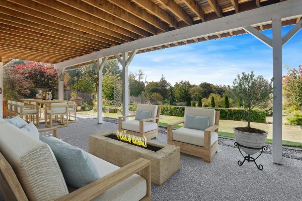 Luxury Backyard Escape Backyard with wooden pergola and a wooden patio set