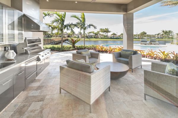 Outdoor Coastal Kitchen Outdoor kitchen with grey countertops and stainless steel appliances