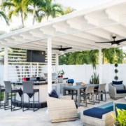 white pergola with ceiling fans and outdoor furniture underneath