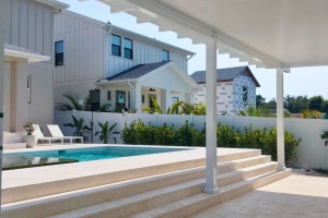 White modern pergola with poolside view