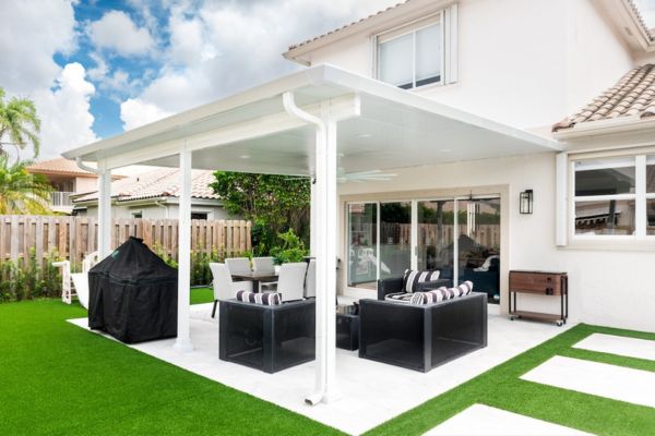 Moderno Renaissance Pergola white pergola with black and white outdoor furniture underneath