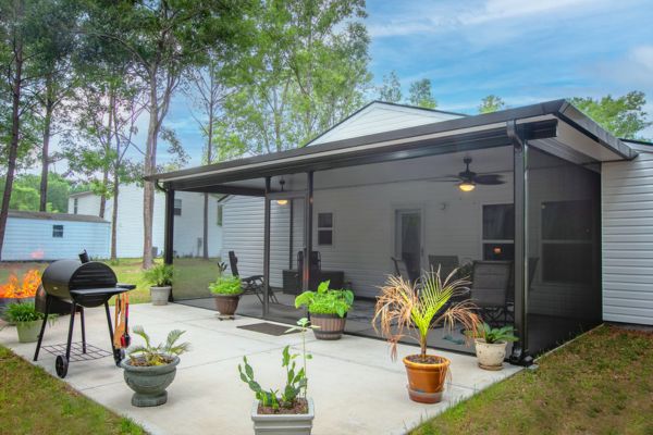 Dolce Renaissance Pergola White and black pergola with outdoor screen and ceiling fans