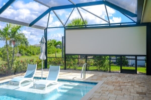 Motorized screen installed on pool cage