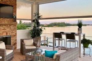 Second floor patio with furniture and shade screen